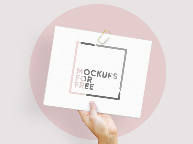 Hand Holding Paper PSD Mockup