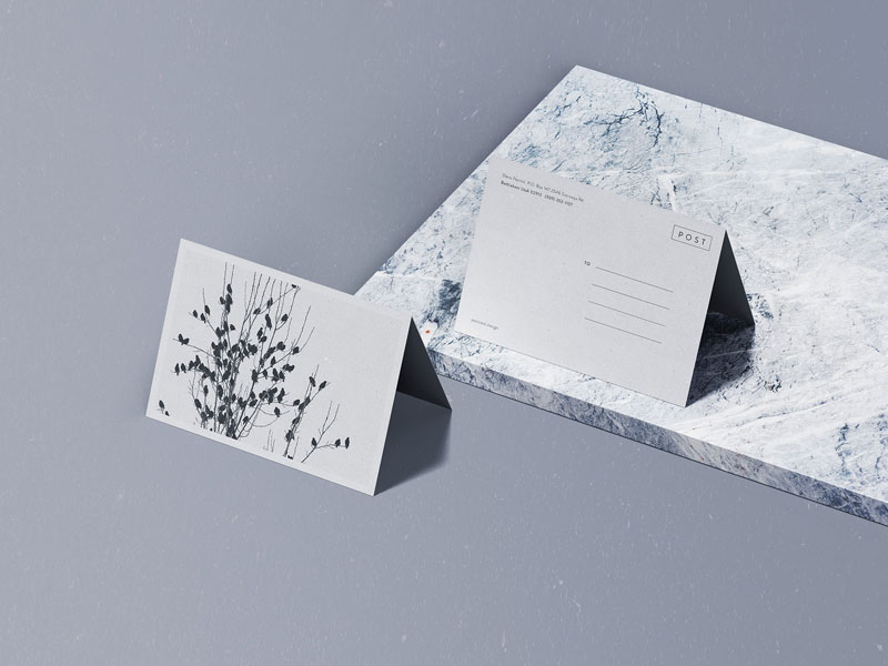 Folded Postcard On Marble PSD Mockup